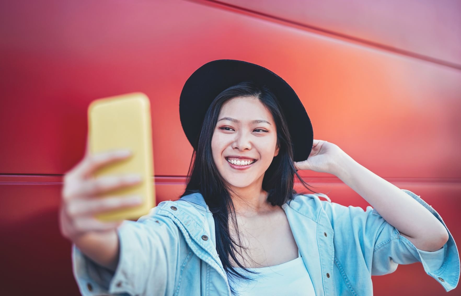 woman selfie red bg