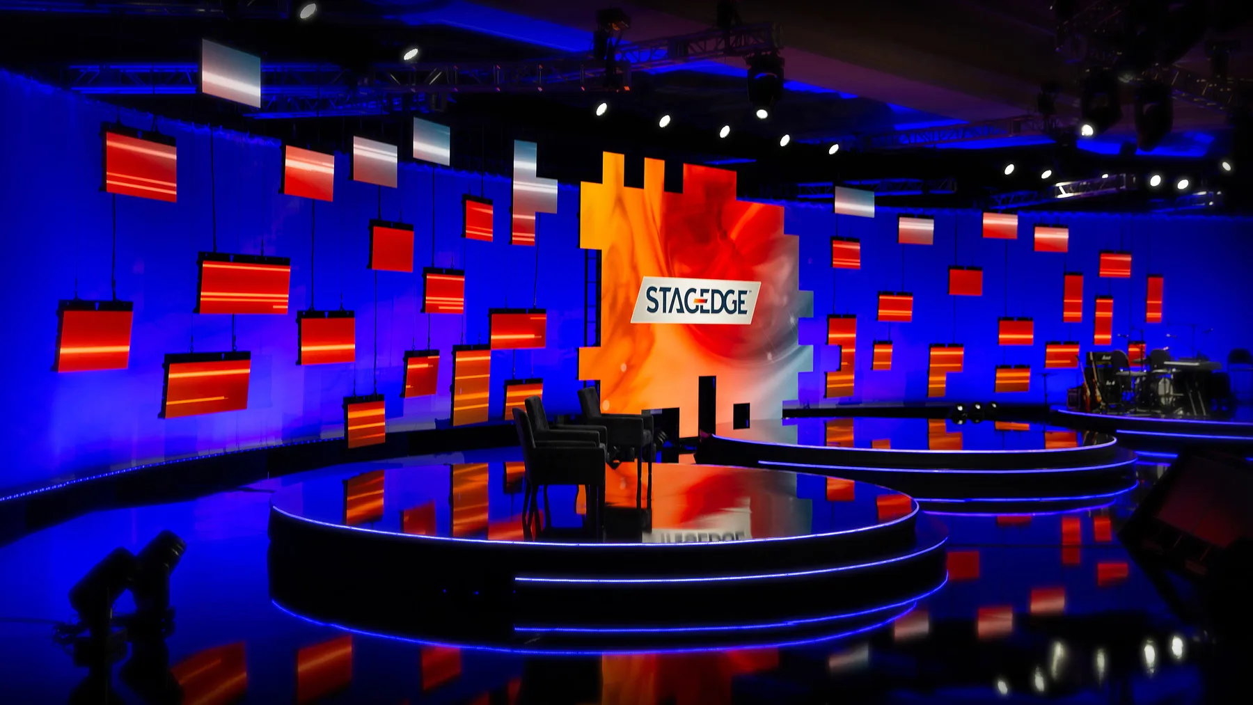 Presenter speaking to camera in a virtual event studio
