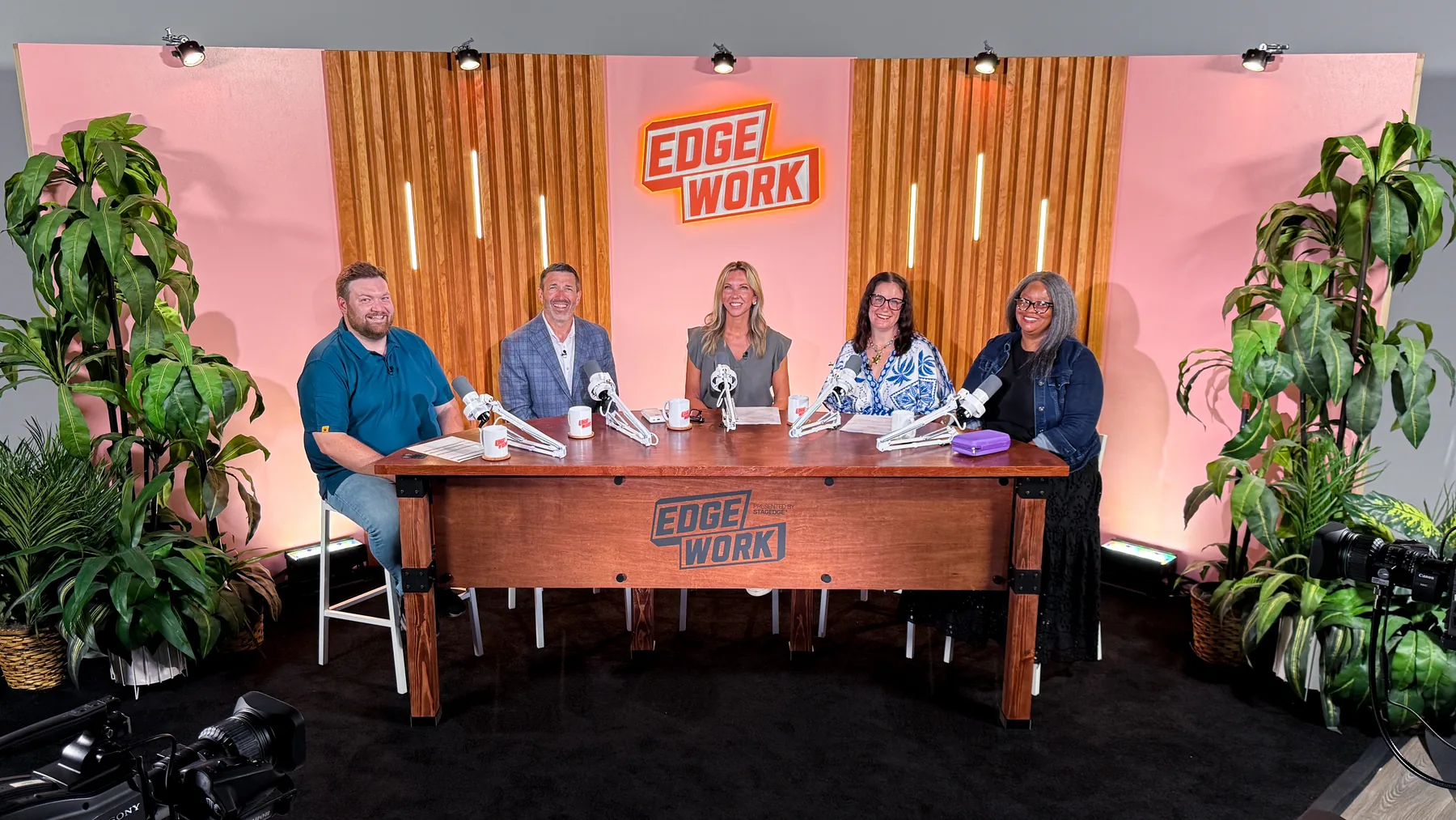 Five event industry professionals seated around a table during a podcast recording