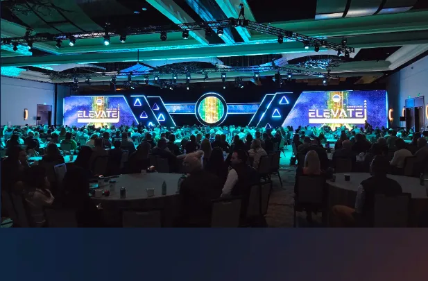 Audience engaged during a live corporate event general session