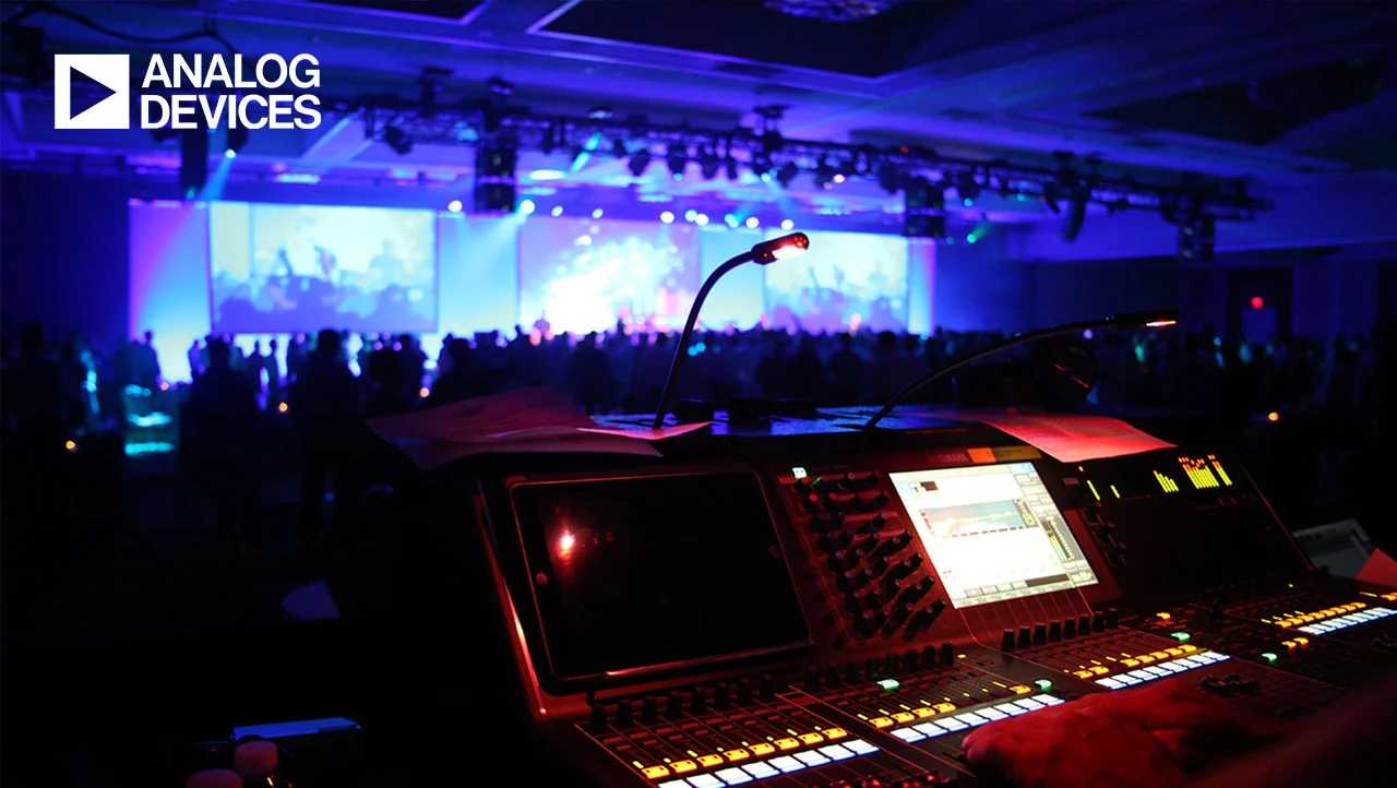 Attendees seated in a darkened ballroom during the Analog Devices global sales conference general session