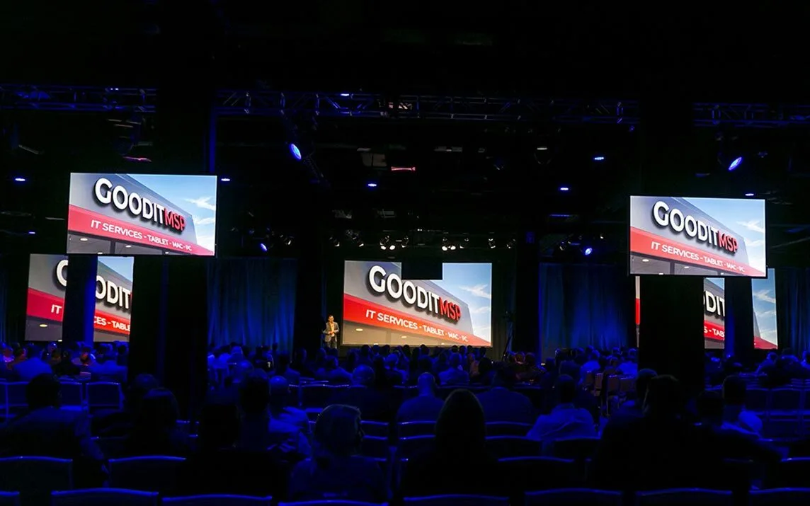 General session stage and seated audience at the Continuum Navigate conference