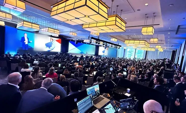General session stage and LED screens set for a private equity annual general meeting in a Boston ballroom